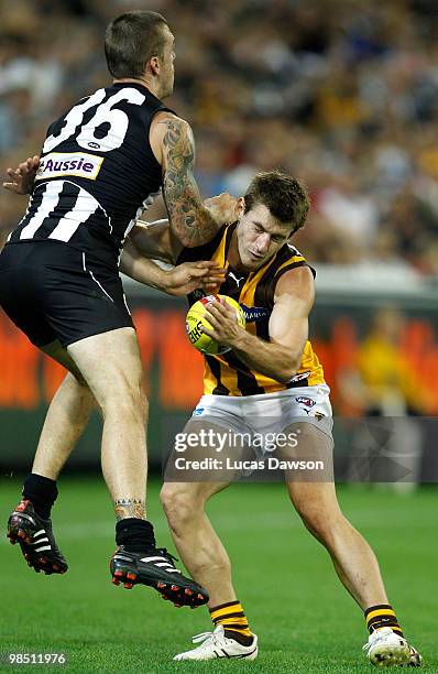 Dane Swan of the Magpies contest against Brendan Whitecross of the Hawks during the round four AFL match between the Collingwood Magpies and the...