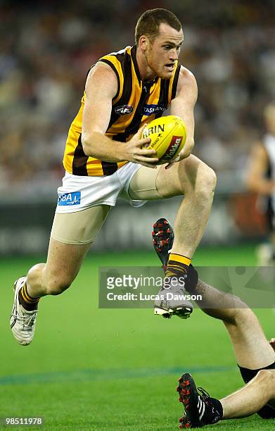 Jarryd Roughead of the Hawks jumps over a player during the round four AFL match between the Collingwood Magpies and the Hawthorn Hawks at Melbourne...