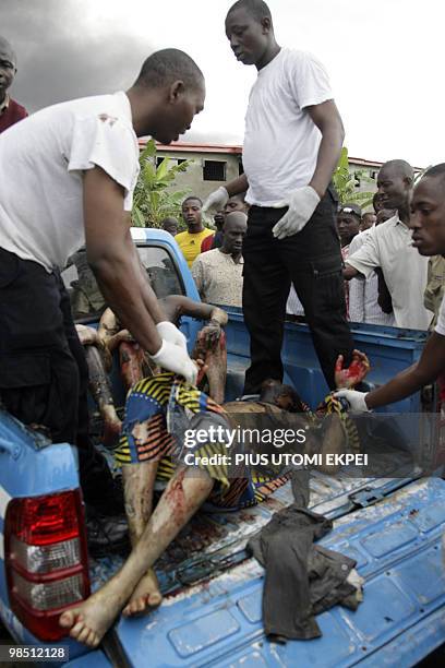 Man rescued from the fire is being taken to the hospital by officials of the Federal Road Safety at the scene of the fire at Ibafo, Ogun State on...