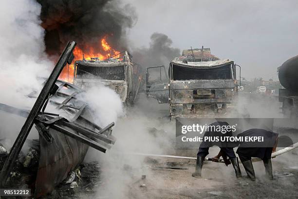 Firefighters try to put out a fire on Lagos Ibadan Highway in Ibafo in the early hours of April 17, 2010 after two tankers filled with petrol and...