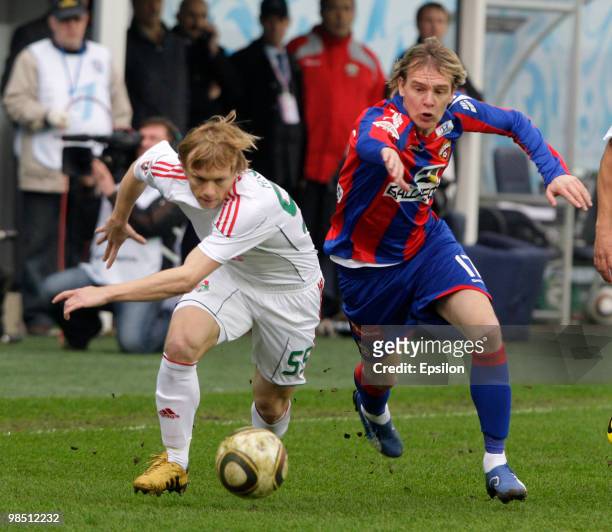 Milos Krasic of PFC CSKA Moscow battles for the ball with Renat Yanbayev of FC Lokomotiv Moscow during the Russian Football League Championship match...