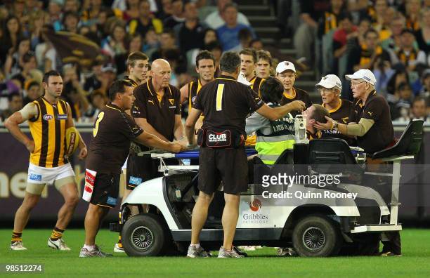 Xavier Ellis of the Hawks is stretchered off the ground during the round four AFL match between the Collingwood Magpies and the Hawthorn Hawks at...