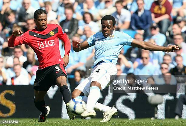Patrice Evra of Manchester United clashes with Nedum Onuoha of Manchester City during the Barclays Premier League match between Manchester City and...