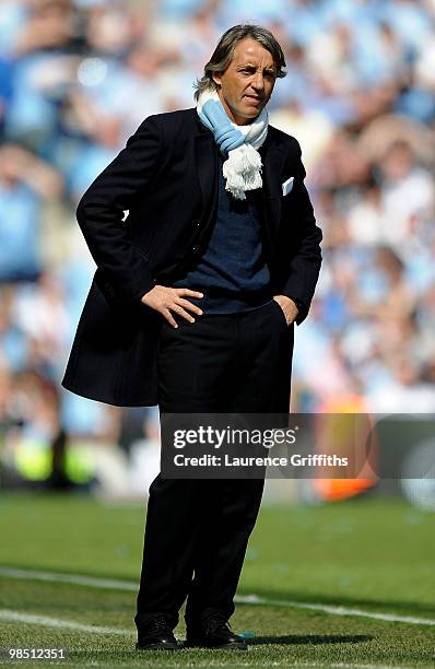 Manchester City Manager Roberto Mancini looks on during the Barclays Premier League match between Manchester City and Manchester United at the City...