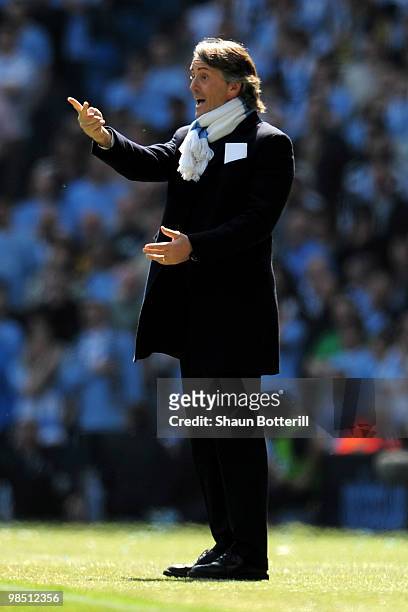 Manchester City Manager Roberto Mancini issues instructions during the Barclays Premier League match between Manchester City and Manchester United at...