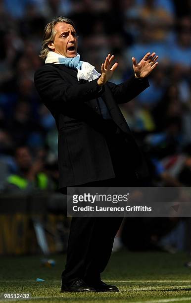 Manchester City Manager Roberto Mancini reacts during the Barclays Premier League match between Manchester City and Manchester United at the City of...