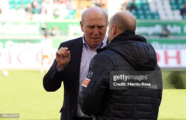 Manager Dieter Hoeness of Wolfsburg talks to head coach Thomas Schaaf of Bremen prior to the Bundesliga match between VfL Wolfsburg and SV Werder...