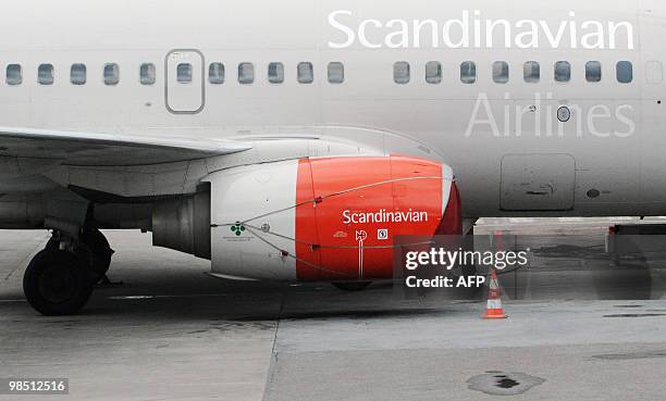 Cover protects an engine on a parked Scandinavian Airlines Boeing 737 aircraft at Bromma airport in Stockholm on April 17, 2010. Millions of people...