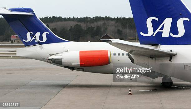 Two parked Scandinavian Airlines aircrafts are seen at Arlanda airport in Stockholm on April 17, 2010. Millions of people faced worsening travel...