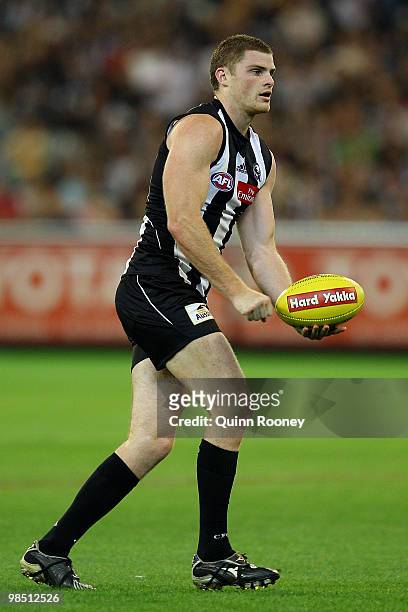 Heath Shaw of the Magpies handballs during the round four AFL match between the Collingwood Magpies and the Hawthorn Hawks at Melbourne Cricket...