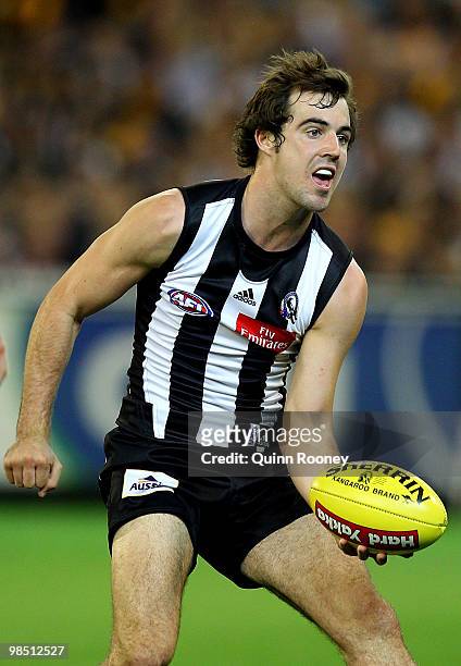 Steele Siddebottom of the Magpies handballs during the round four AFL match between the Collingwood Magpies and the Hawthorn Hawks at Melbourne...