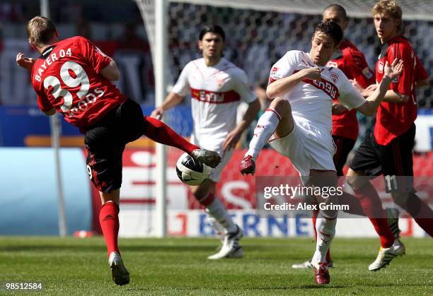 Toni Kroos of Leverkusen is challenged by Christian Traesch of Stuttgart during the Bundesliga match between VfB Stuttgart and Bayer Leverkusen at...