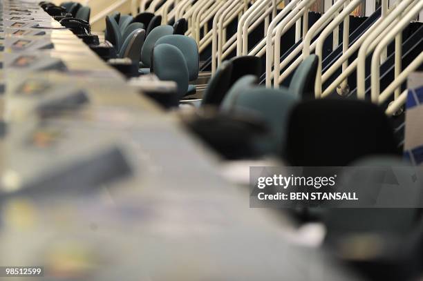 Disused check-in desks are seen in a deserted terminal at the Birmingham International Airport in Birmingham, central England, on April 17, 2010....