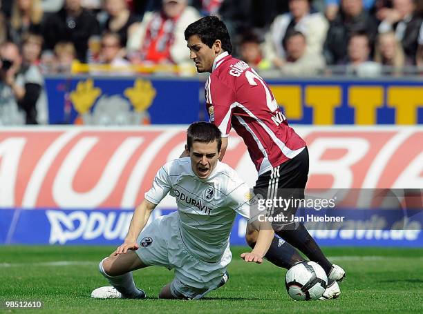 Johannes Flum of Freiburg battles for the ball with Ilkay Guendogan of Nuernberg during the Bundesliga match between SC Freiburg and 1.FC Nuernberg...