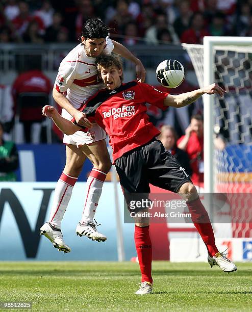 Stefan Kiessling of Leverkusen is challenged by Serdar Tasci of Stuttgart during the Bundesliga match between VfB Stuttgart and Bayer Leverkusen at...