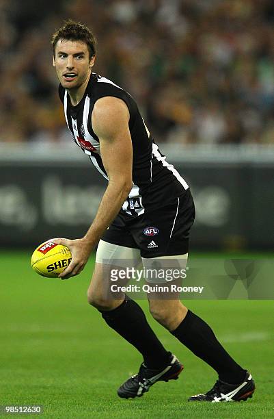 Darren Jolly of the Magpies looks to handball during the round four AFL match between the Collingwood Magpies and the Hawthorn Hawks at Melbourne...
