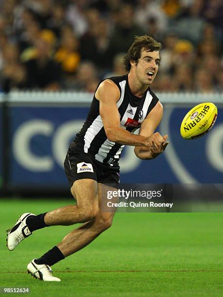 Steele Siddebottom of the Magpies handballs during the round four AFL match between the Collingwood Magpies and the Hawthorn Hawks at Melbourne...