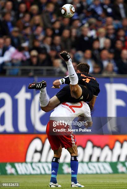 Ruud van Nistelrooy of Hamburg and Nikolce Noveski of Mainz compete for the ball during the Bundesliga match between Hamburger SV and FSV Mainz 05 at...