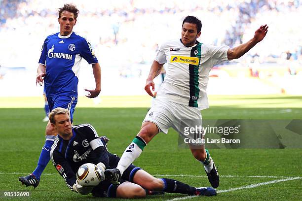 Raul Bobadilla of Moenchengladbach gets the ball before goalkeeper Manuel Neuer of Schalke and scores the second goal during the Bundesliga match...