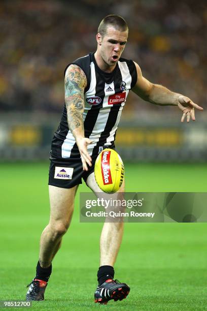 Dane Swan of the Magpies kicks during the round four AFL match between the Collingwood Magpies and the Hawthorn Hawks at Melbourne Cricket Ground on...