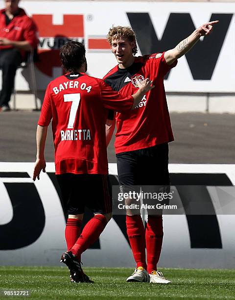 Stefan Kiessling of Leverkusen celebrates his team's first goal with team mate Tranquillo Barnetta during the Bundesliga match between VfB Stuttgart...