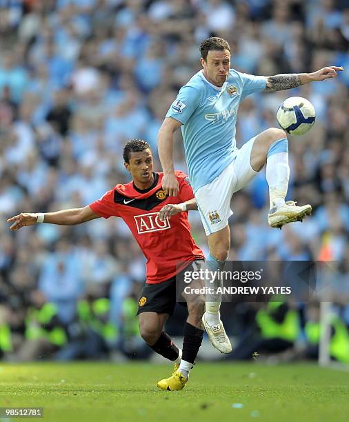 Manchester City's English defender Wayne Bridge vies with Manchester United's Portuguese midfielder Nani during the English Premier League football...