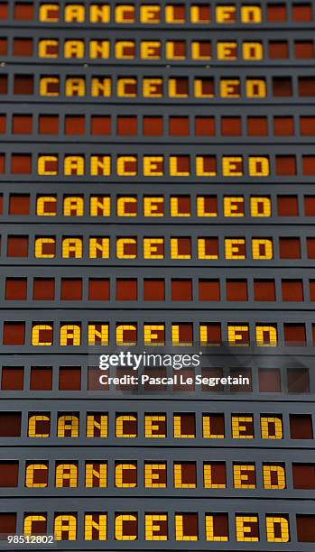 Flight information board indicates cancelled flights at Roissy Charles-de-Gaulle terminal E after airports including Charles de Gaulle and Orly were...