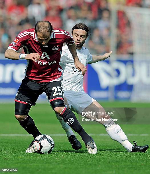 Jonathan Jaeger of Freiburg battles for the ball with Javier Horacio Pinola of Nuernberg during the Bundesliga match between SC Freiburg and 1.FC...