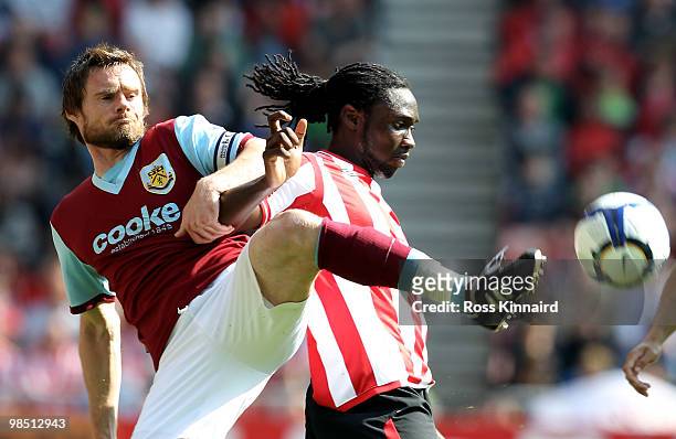 Graham Alexander of Burnley is challenged by Kenwyne Jones of Sunderland during the Barclays Premier League match between Sunderland and Burnley at...