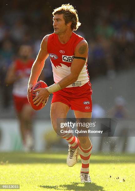 Brett Kirk of the Swans kicks during the round four AFL match between the North Melbourne Kangaroos and the Sydney Swans at Etihad Stadium on April...