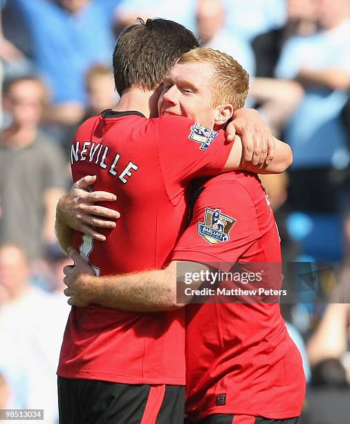 Paul Scholes and Gary Neville of Manchester United celebrate after the Barclays Premier League match between Manchester City and Manchester United at...