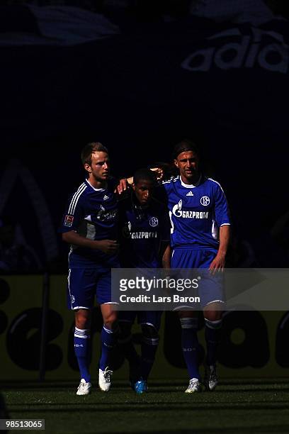 Jefferson Farfan of Schalke celebrates with team mates Ivan Rakitic and Marcelo Bordon scoring his teams second goal during the Bundesliga match...