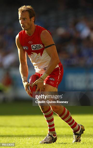 Jude Bolton of the Swans kicks during the round four AFL match between the North Melbourne Kangaroos and the Sydney Swans at Etihad Stadium on April...