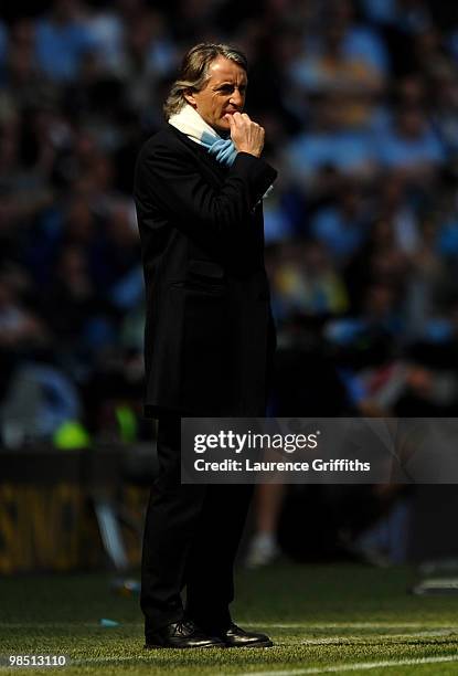 Manchester City Manager Roberto Mancini looks on during the Barclays Premier League match between Manchester City and Manchester United at the City...