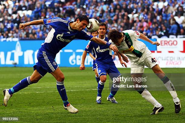 Kevin Kuranyi of Schalke goes up for a header with Roel Brouwers of Moenchengladbach during the Bundesliga match between FC Schalke 04 and Borussia...