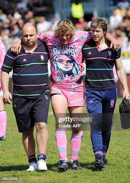 Wounded Stade Francais's winger Micro Bergamasco leaves the field during the French Top 14 rugby union match Albi vs. Stade Francais on April 17,...