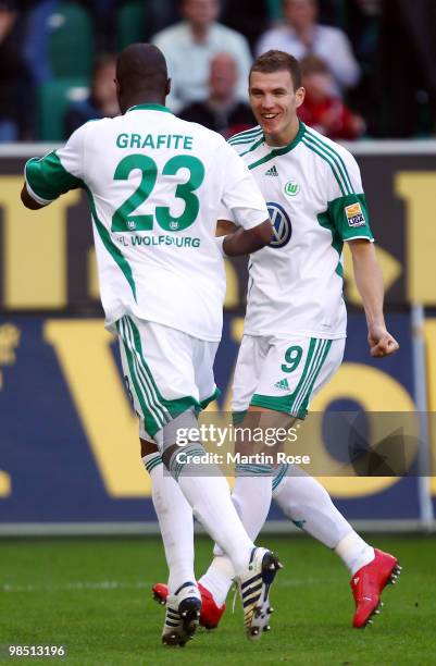 Grafite of Wolfsburg celebrates after scoring his team's second goal with team mate Edin Dzeko during the Bundesliga match between VfL Wolfsburg and...