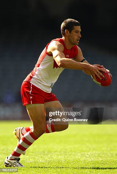 Martin Mattner of the Swans kicks during the round four AFL match between the North Melbourne Kangaroos and the Sydney Swans at Etihad Stadium on...