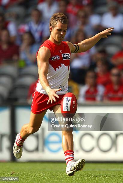 Ben McGlynn of the Swans kicks during the round four AFL match between the North Melbourne Kangaroos and the Sydney Swans at Etihad Stadium on April...