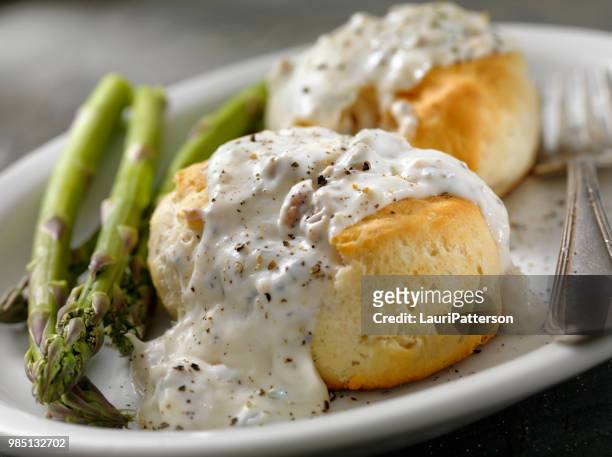 sausage gravy and biscuits - buttermilk biscuit stock pictures, royalty-free photos & images