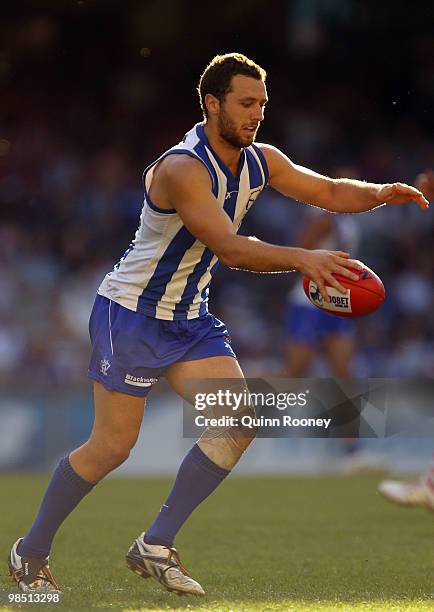 Scott McMahon of the Kangaroos kicks during the round four AFL match between the North Melbourne Kangaroos and the Sydney Swans at Etihad Stadium on...