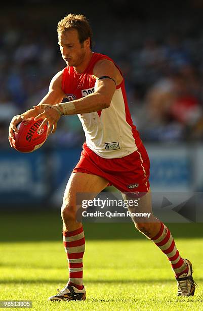 Jude Bolton of the Swans kicks during the round four AFL match between the North Melbourne Kangaroos and the Sydney Swans at Etihad Stadium on April...