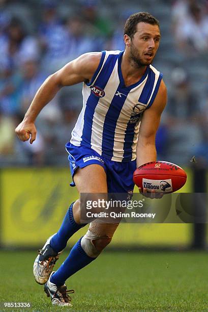Scott McMahon of the Kangaroos handballs during the round four AFL match between the North Melbourne Kangaroos and the Sydney Swans at Etihad Stadium...