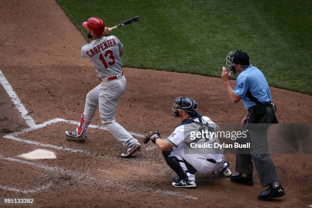 Matt Carpenter of the St. Louis Cardinals hits a single in the fourth inning against the Milwaukee Brewers at Miller Park on June 24, 2018 in...