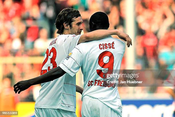 Julian Schuster and Papiss Demba Cisse of Freiburg celebrate their second goal during the Bundesliga match between SC Freiburg and 1.FC Nuernberg at...