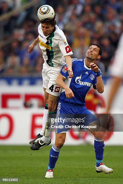 Roel Brouwers of Gladbach and Kevin Kuranyi of Schalke go up for a header during the Bundesliga match between FC Schalke 04 and Borussia...