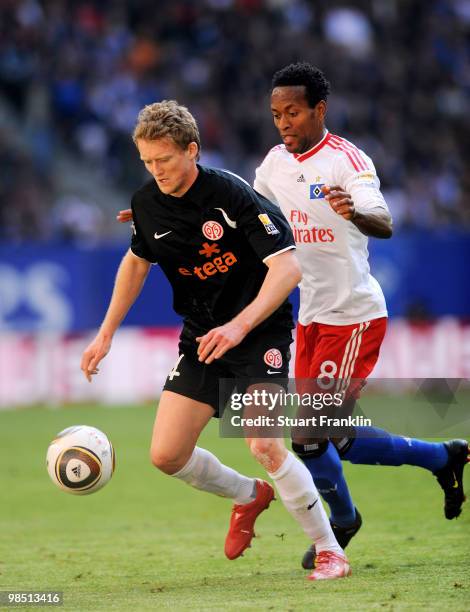 Ze Roberto of Hamburg is challenged by Nikolce Noveski of Mainz during the Bundesliga match between Hamburger SV and FSV Mainz 05 at HSH Nordbank...