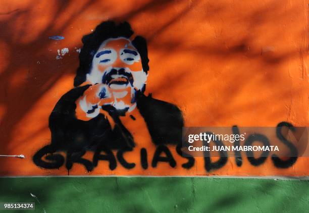 View of a graffiti depicting former Argentina's national football team coach Diego Maradona in a wall in Mendoza, Argentina on July 31, 2010. AFP...