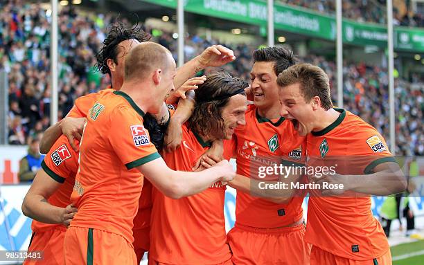 Torsten Frings of Bremen celebrates after scoring his team's third goal with team mates during the Bundesliga match between VfL Wolfsburg and SV...