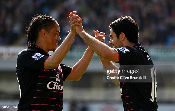 Mikel Arteta of Everton celebrates with Steven Pienaar after scoring the first goal from the penalty spot during the Barclays Premier League match...